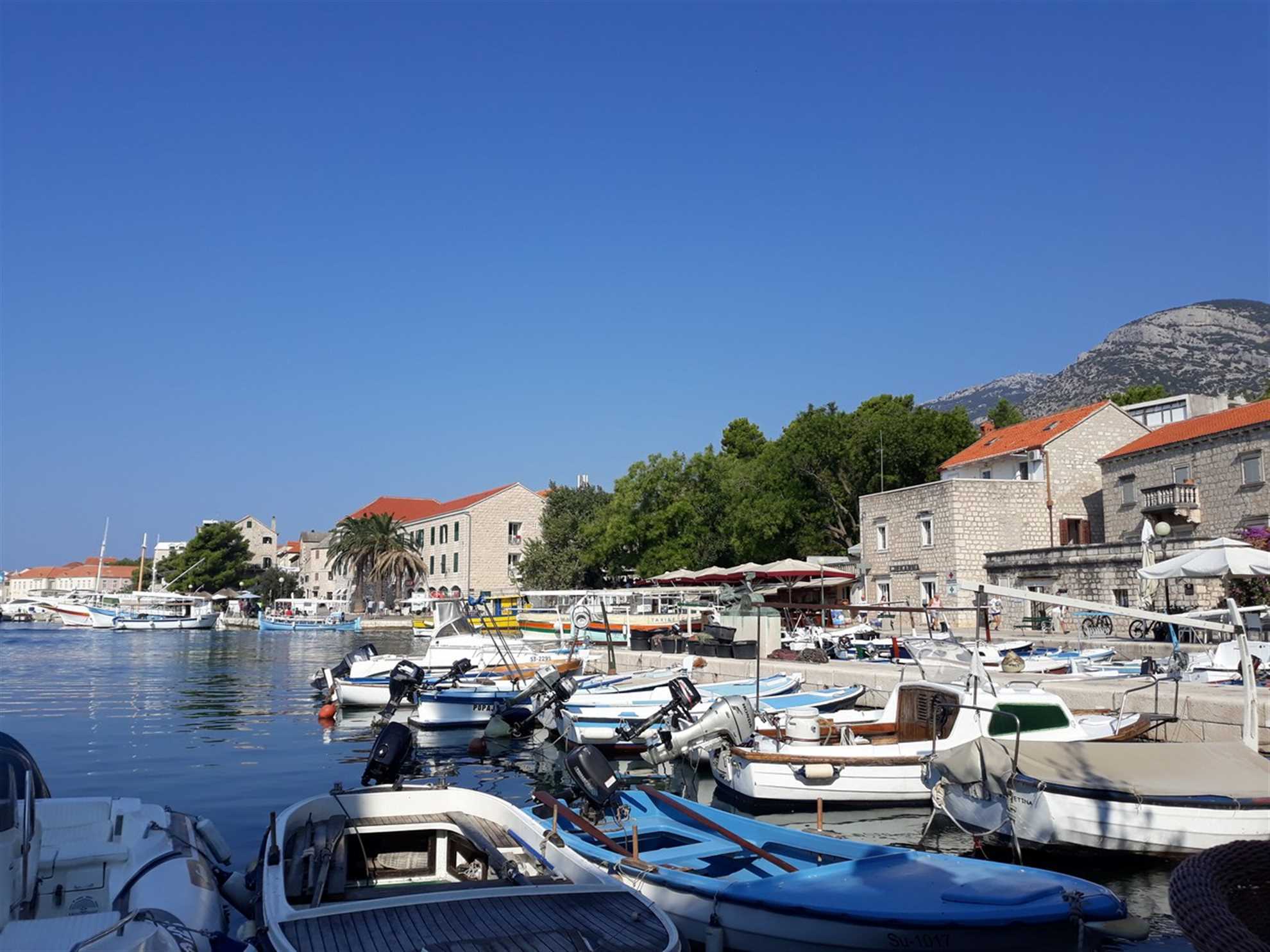 Port for small boats in the town of Bol on Brac island and Promenade