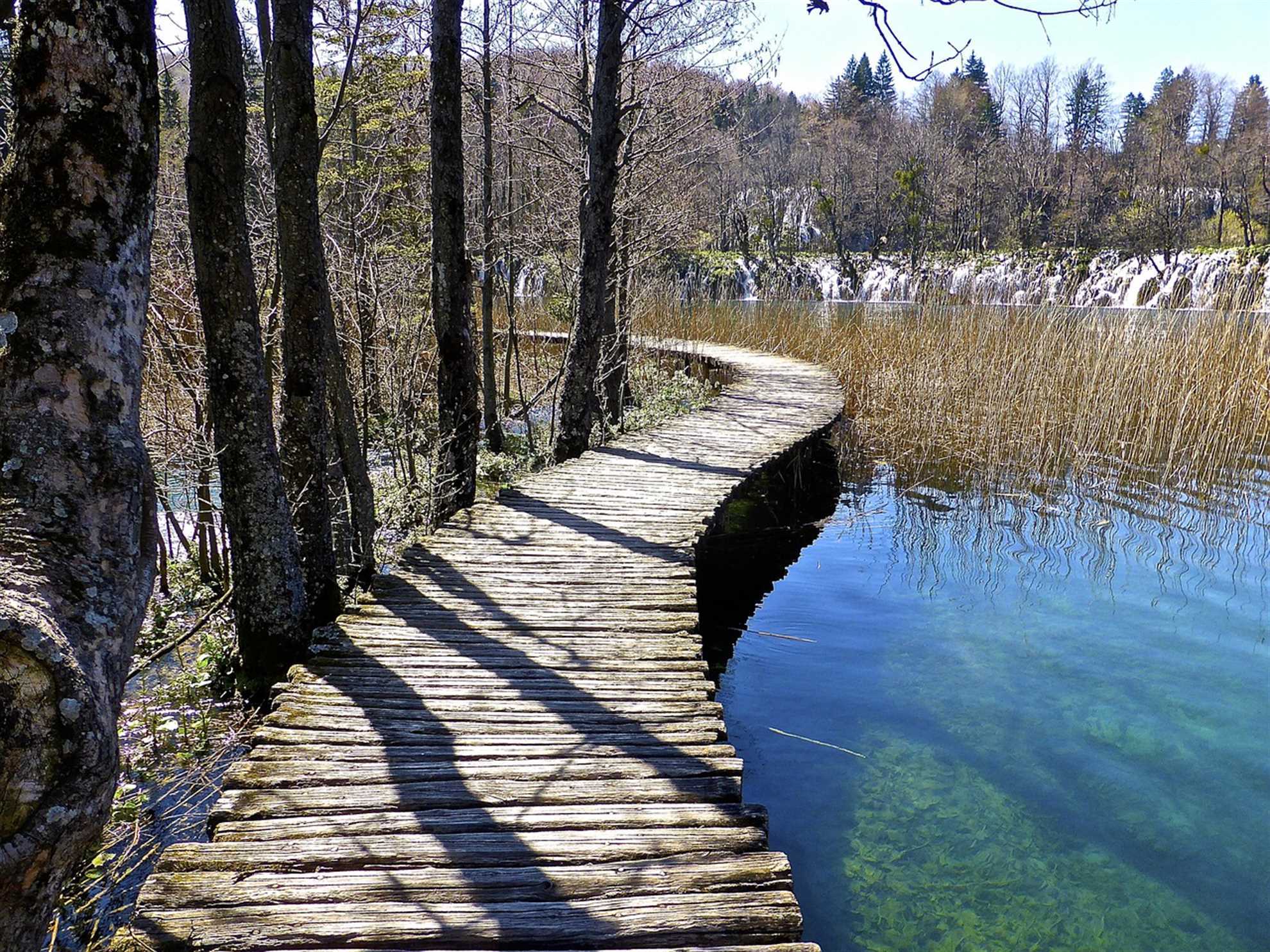 Wooden pathways across the lakes in Plitvice late autmn time